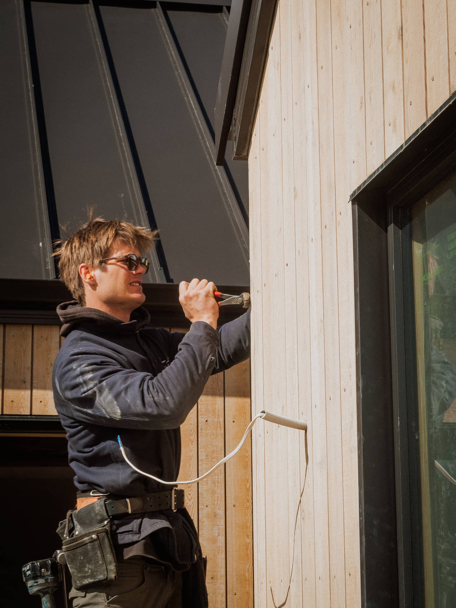 Cedar cladding being fixed at Jack's Point